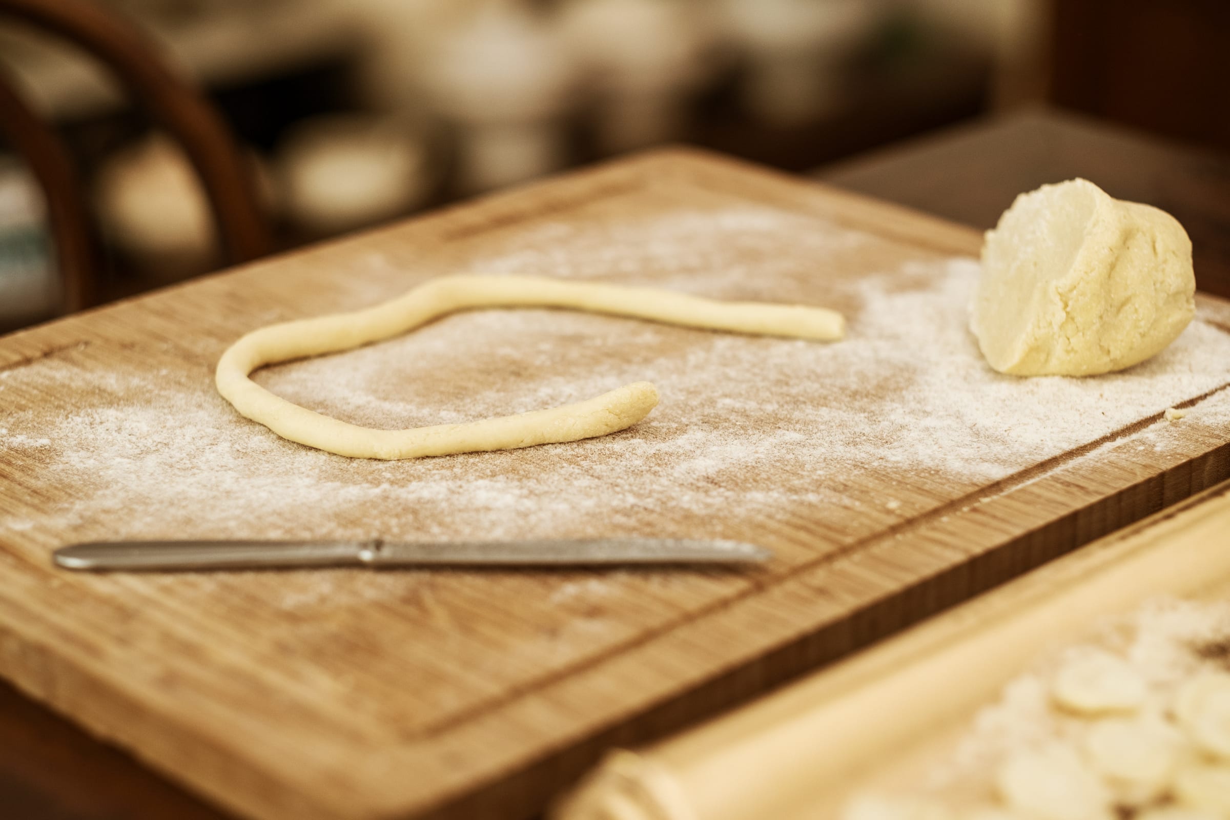 Hand-shaped orecchiette drying on a board